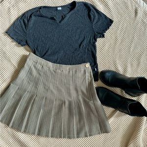 Urban Outfitters plaid pleated short skirt with button and zip closure.